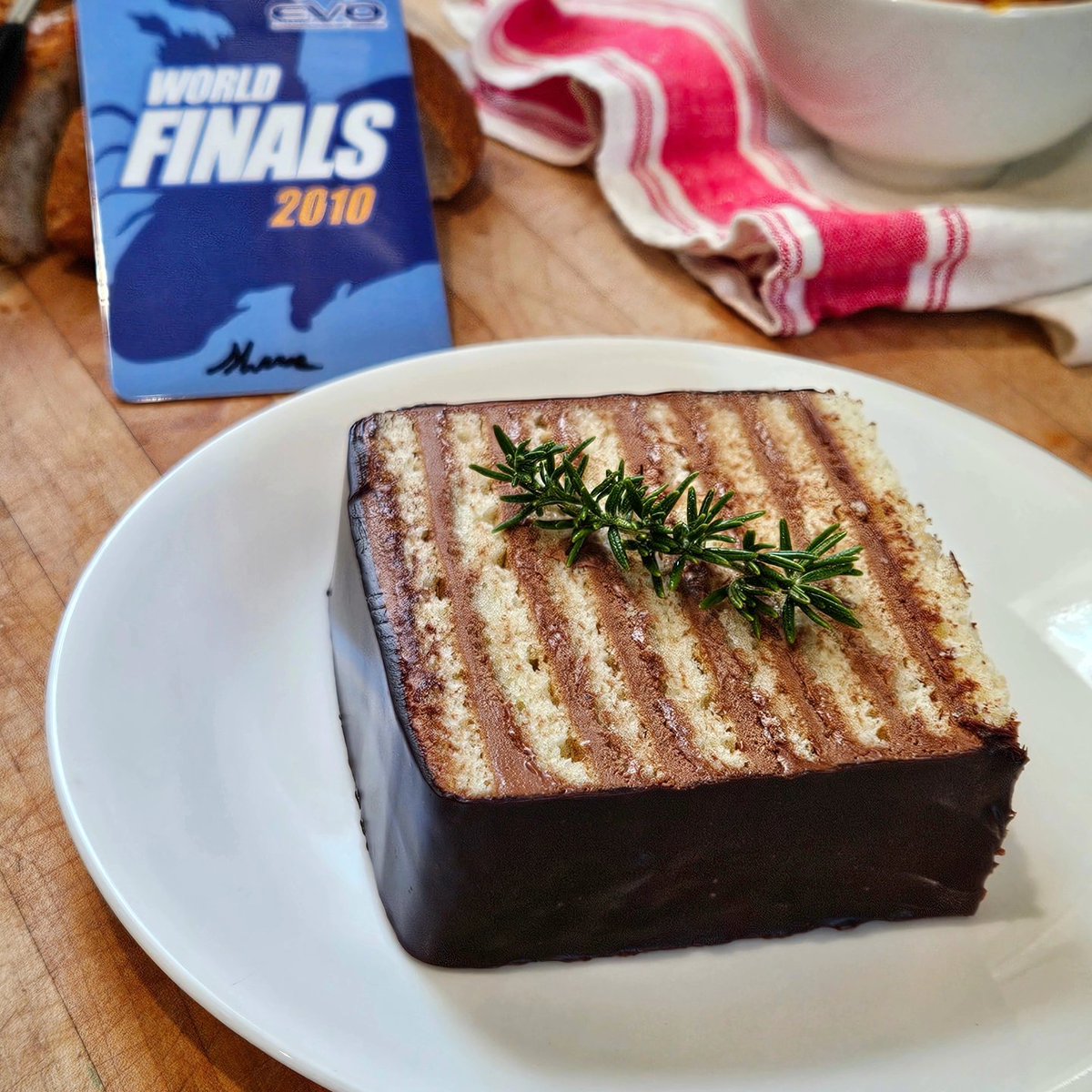 thefedups's tweet photo. Evo 2024 finals! Street Fighter 6 top 6 about to go underway. Shane Shizza Cummings' birthday. 

Always gonna remember 2010 SF4 finals. Top 8 Chun ✊️

A slice of chocolate cake for you. I know you'd still be rocking Chun. Happy birthday Shane.

#Evo2024 #StreetFighter #Shizza https://t.co/yqHFiCCQcX