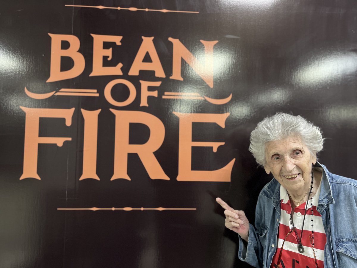 Nancybartosz's tweet photo. Arrived in El Salvador at 2:00 AM - and @BeanofFire coffee is the first sign we see. Hoping to try a cup this week! This lady has years of coffee drinking experience and can't wait to try it. https://t.co/AkBiV3Dqtm