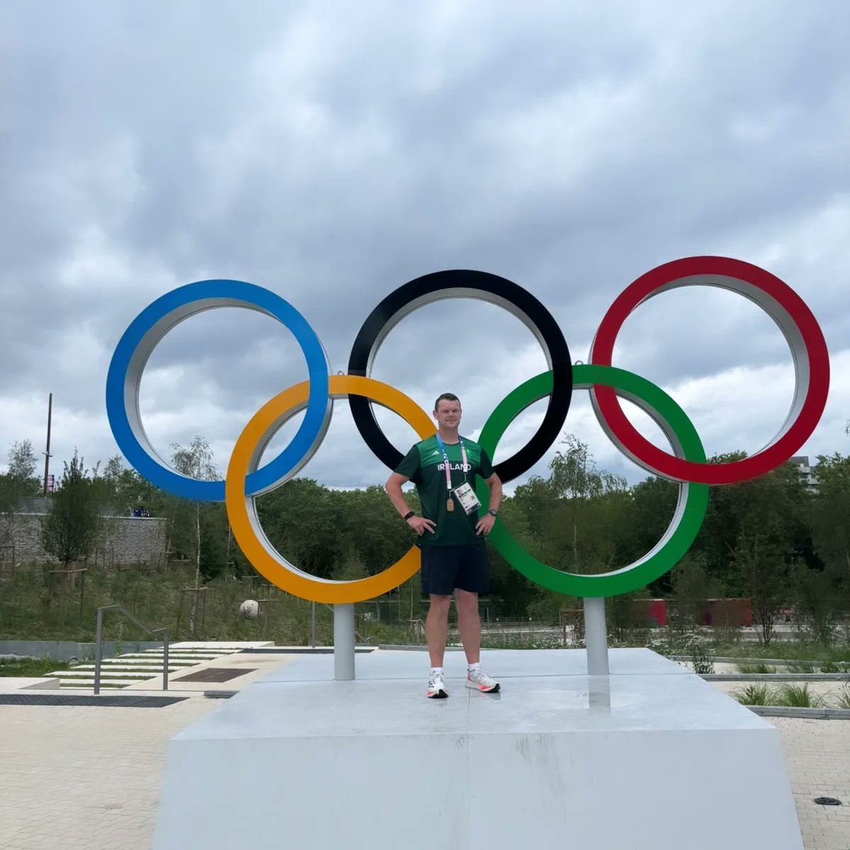 Congratulations to our very own <a href="/peterdonnelly1/">Peter Donnelly</a> who a young boy from Annagher who has worked hard and endlessly to become one of the top coaches in sport and now stands proudly with the blue jersey of Fianna Oileán an Ghuail CLG in front of the Olympics logo in Paris. More on FB