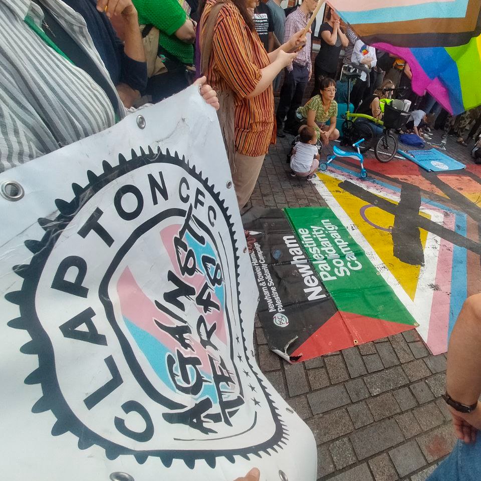 ClaptonCFC's tweet photo. No to LGBTQ+ hate! 

Forest Gate came out in force tonight to redraw the Progress Pride flag at the station. 

We're proud to wear the flag on our sleeve 🏳️‍🌈🏳️‍⚧️ https://t.co/YQ4k7I0kjI