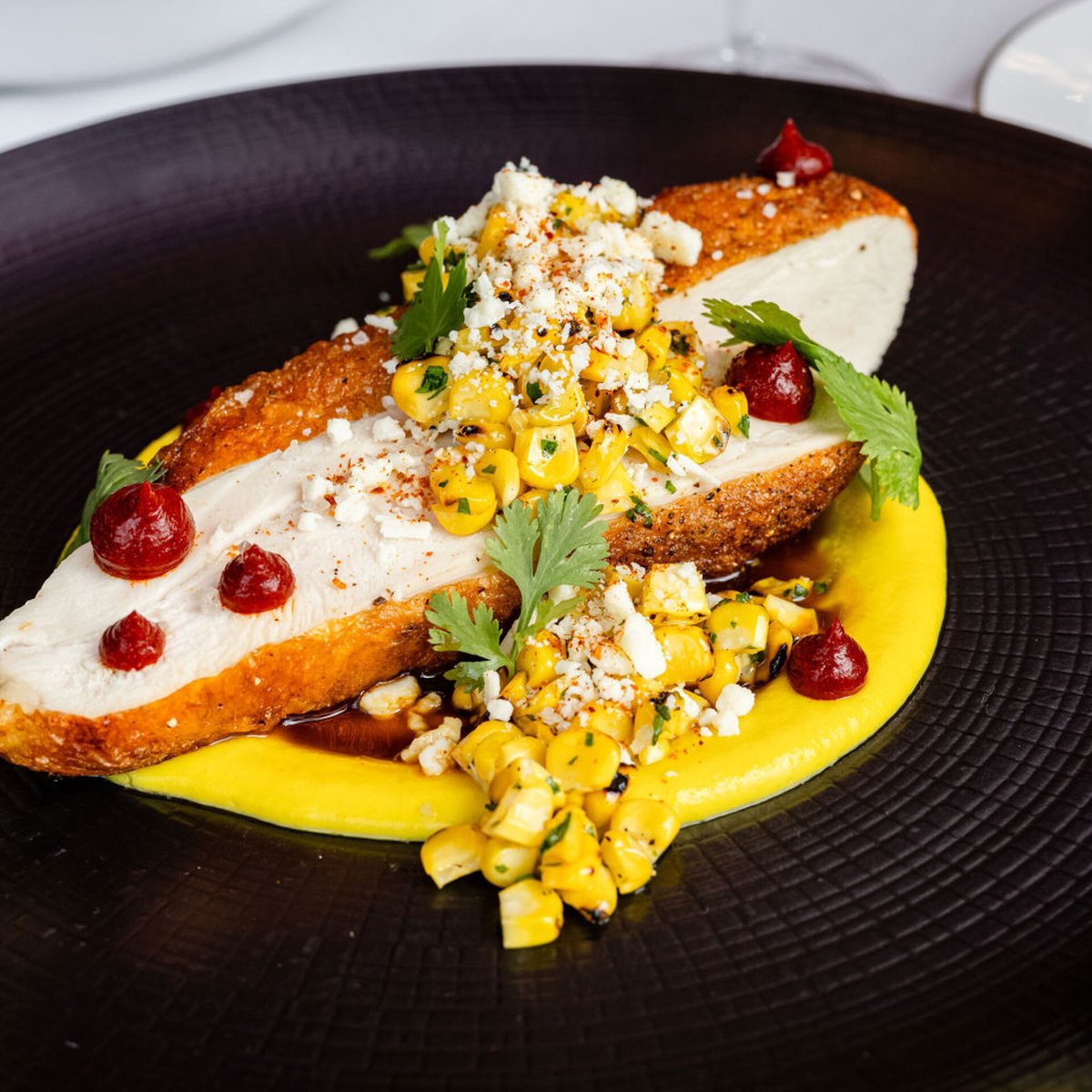 Street Corn Chicken Breast | Cotija Cheese · Guajillo Pepper · Cilantro, Jus