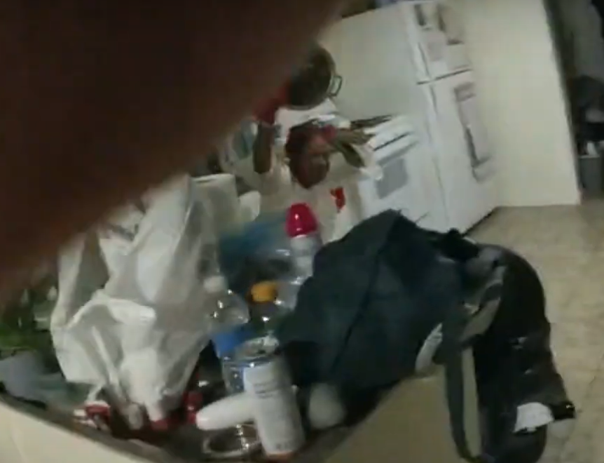 Enginerd's tweet photo. @WarPath2pt0 The last frame in which she's visible, holding up the now empty pot. This is half a second before shots fired.
Imo it was a misguided attempt on her part to show it was empty but the officer pulled the trigger anyway.
No way he genuinely thought he was in danger at that point. https://t.co/49hiQPypyU