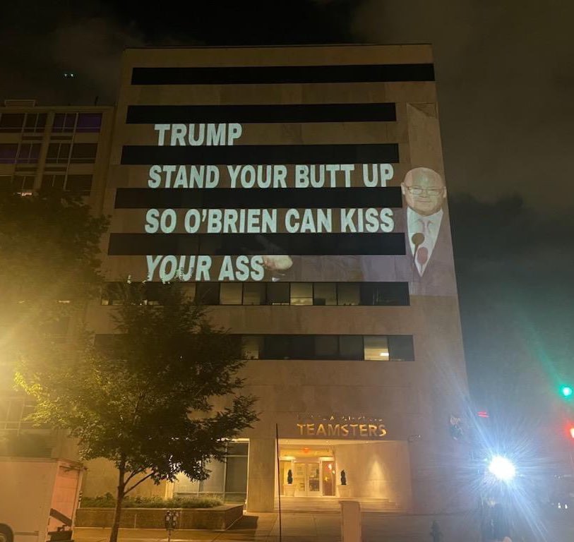 GrimKim's tweet image. Yikes. The Teamsters HQ in D.C. is currently lit up with insults from someone who seems to be a little unimpressed with O’Brien’s RNC appearance.

“International Brotherhood of Trumpsters”

“Sean O’Brien is a Class Traitor”

“Trump Stand Your Butt Up So O’Brien Can Kiss Your Ass”