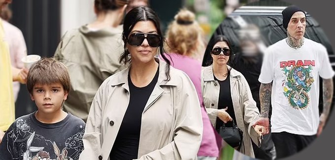 Kourtney Kardashian stuns in a black minidress and tan trench coat while exploring NYC with son Reign and Travis Barker.