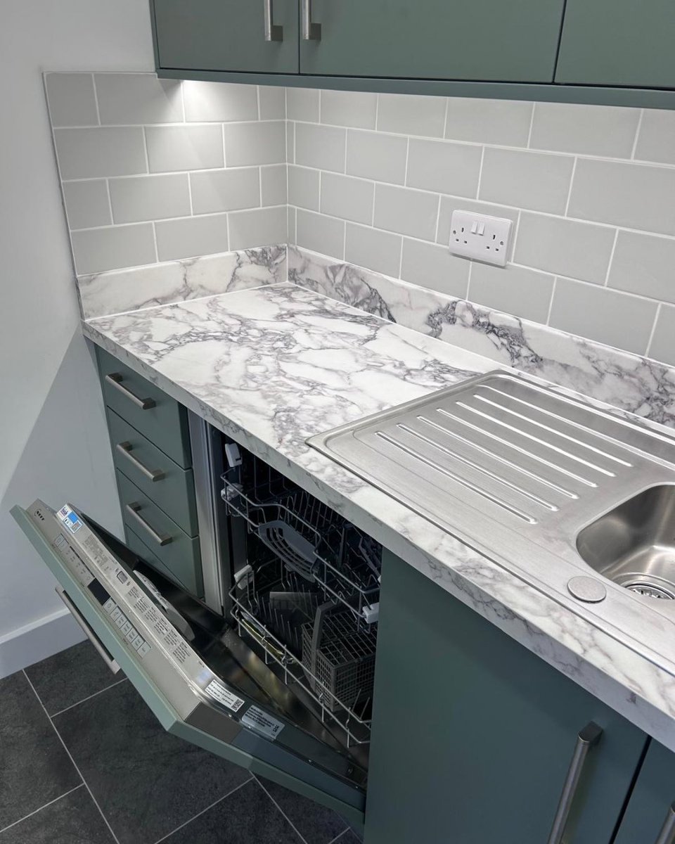 NowCoKitchens's tweet photo. This kitchenette we supplied has been completed by @BILtd_ using Reed Green as previously seen in another recent kitchen of ours, however this time using a slab door rather than shaker style, as well as laminate marble effect worktops all competitively supplied by us 🙌 https://t.co/WRS8ehDQnu