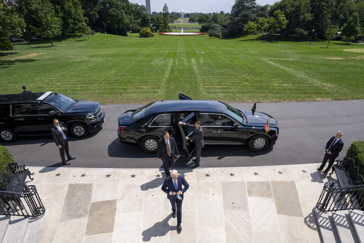 President Biden walks into the White House.