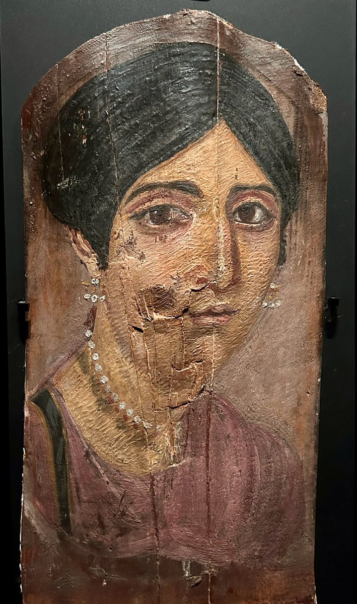 KPW1453's tweet image. The portrait of a woman - one of the mummy portraits from Faiyum in Egypt. The hairstyle dates the portrait to the reign of the Emperor Hadrian (117-138). The portrait is part of the collections @McrMuseum #Woodensday 📷 My own.