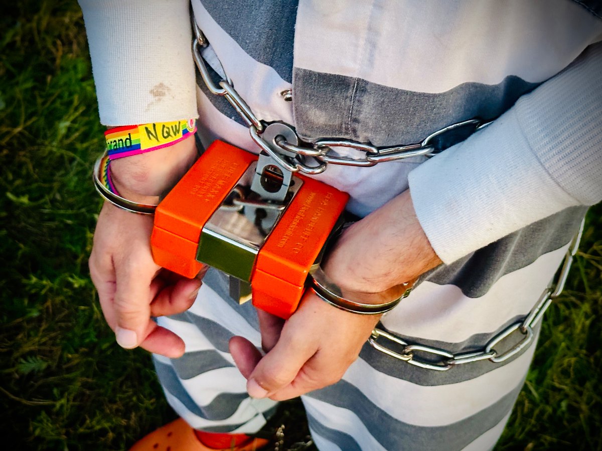 Prisoner in black and white striped uniform. Handcuffs secured with an orange box and waist chain. <a href="/Zaff741/">Zaff</a>  must be a serious criminal!!!