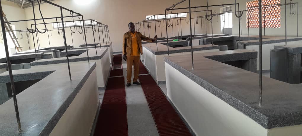 Secretary FOR works kamwnge Mr Yonan Muhwezi checking on the newly constructed kamwenge central market insert(meat &amp; fish ) stalls