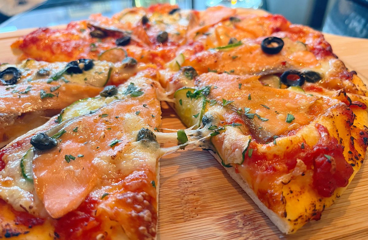 l_feier's tweet photo. Typhoon day-off. Made pizza at home and decided to try cucumber as a topping for the first time. I was expecting a texture like zucchini, but nope, it was still crunchy. 🍕 https://t.co/UFQavTEgrV