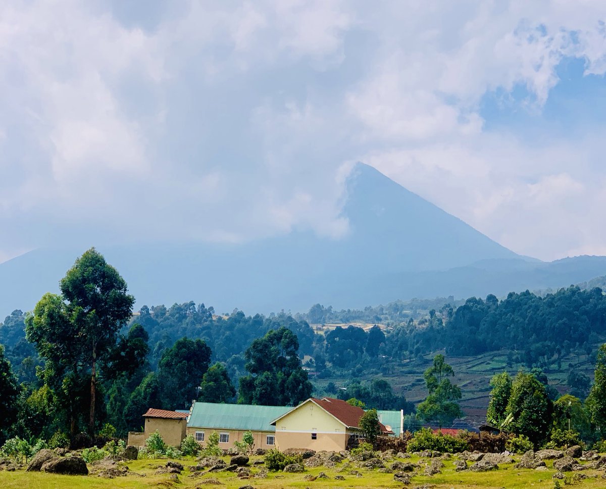 PatiePolly's tweet photo. Spent the better part of yesterday seated in a #meadow somewhere in #Kisoro watching in awe the beauty the 3 mountains; #Muhavura, #Gahinga &amp; #Sabinyo effortlessly embody. 

I prayed hard for the clouds to clear so I can have these beauties.☺️ Muhavura was quite elusive.
💚💚💚 https://t.co/0xW1FU5BlS