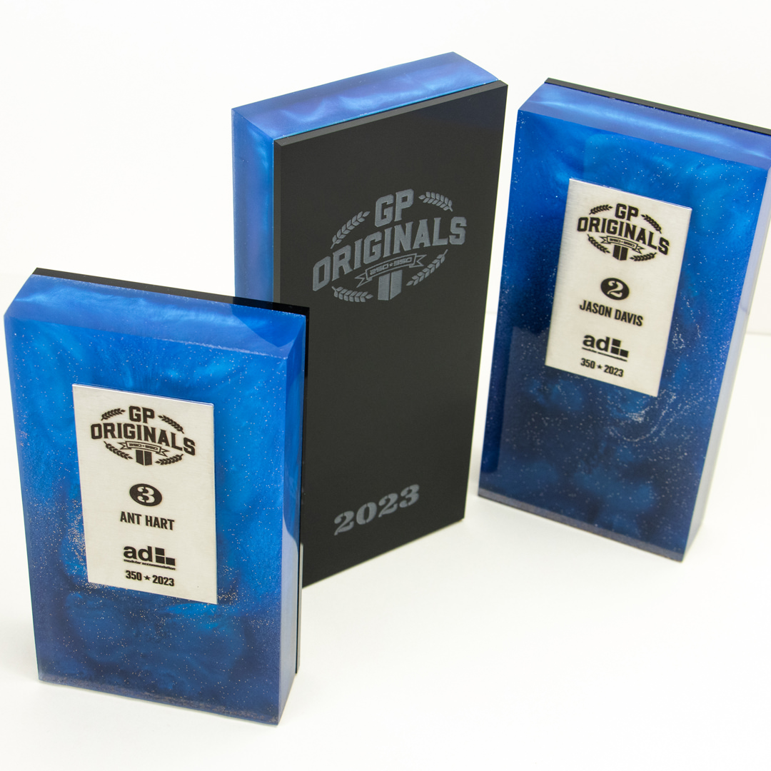 We designed and handmade glossy, colourful custom awards for the 2023 racing season.
Green. Blue. Red – colour for each championship. Gold. Silver. Bronze – glitter for each position
Engraved black acrylic back, brushed stainless names

<a href="/gp_originals/">GP Originals</a> #awards