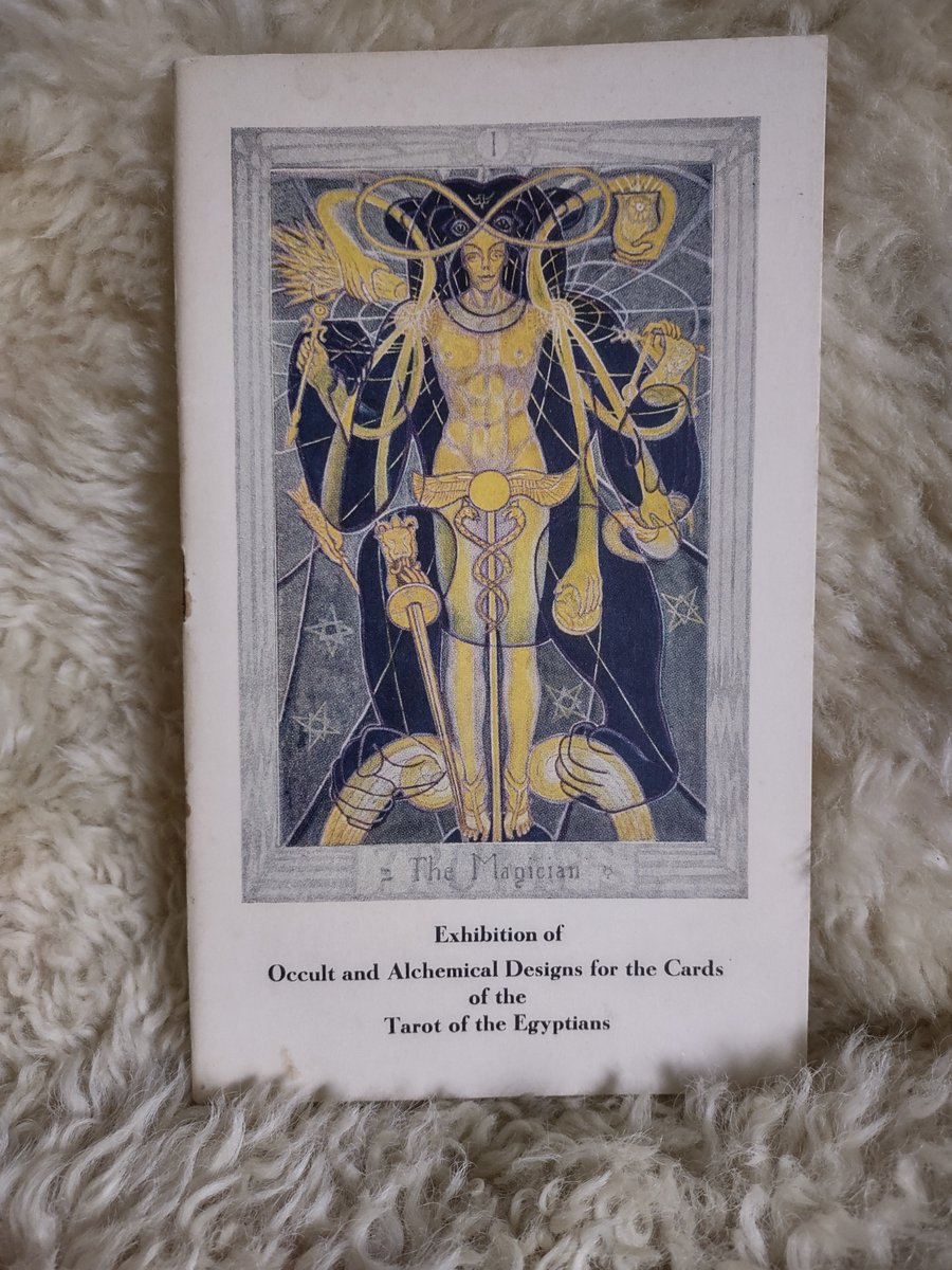An early design of  'The Magician' card in Aleister Crowley's Thoth deck painted by Frieda Harris. When the deck was eventually published the title of this card was changed to 'The Magus.' This is the catalog for an exhibit that took place in 1941.
