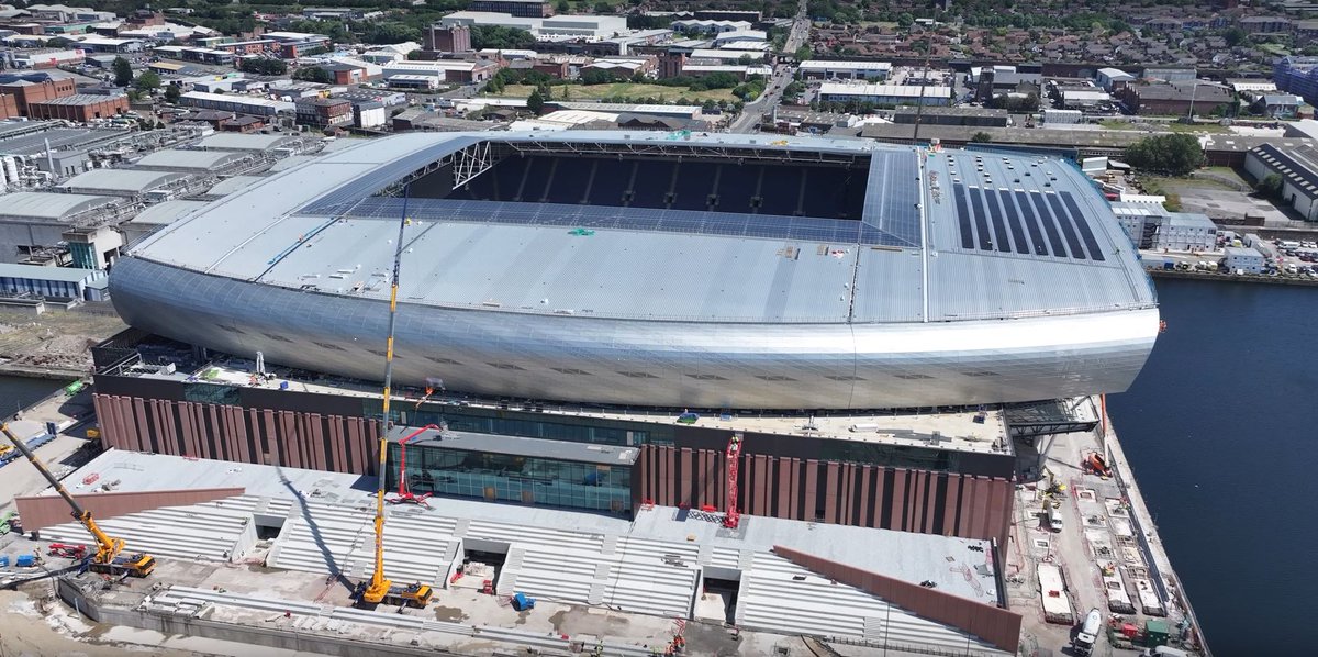 Lindner_Prater's tweet photo. Barrel Cladding Completion!

As the final panel 872 concludes its journey from our pre-fabrication facility in Thurrock to its rightful position at Everton FC, we celebrate the completion of all our barrel cladding installation operations.

#Stadia #Cladding  #EvertonFC https://t.co/kDL4a0VGYA