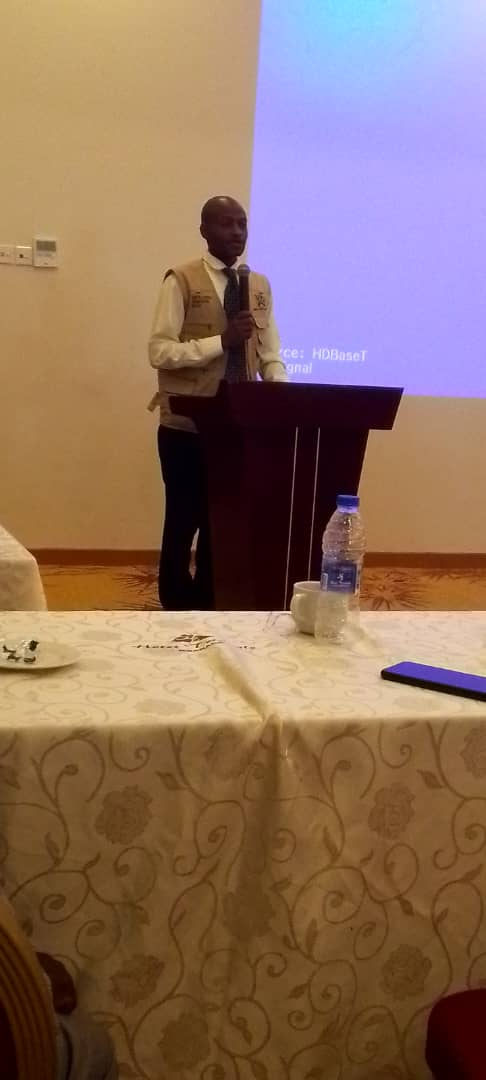 District Chairperson Kamwenge Hon Karungi Joseph delivering closing remarks during a UNHCR  meeting on Refugee response at Hotel triangle Mbarara