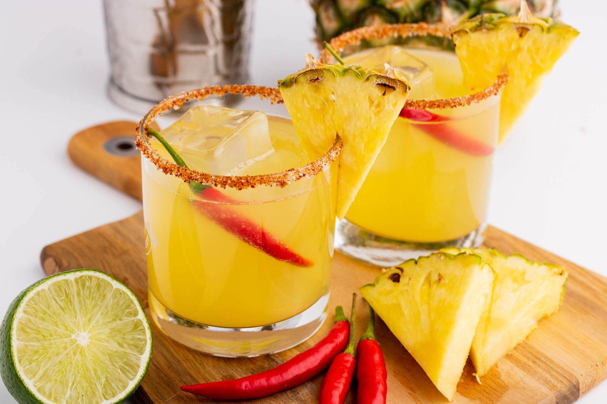 A mouthwatering Spicy Pineapple Margarita is the perfect cocktail. Mix up a batch of these refreshing drinks at your next fiesta. #nationaltequiladay dishnthekitchen.com/irresistible-s…