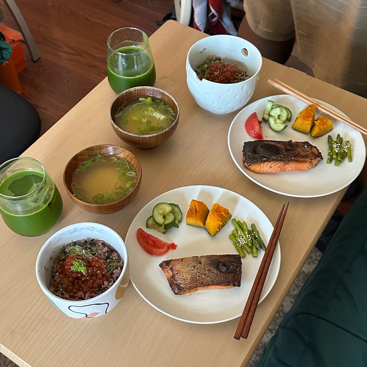 Baked salmon breakfast set with dashi simmered asparagus , kabocha , pickled tomatoes , yuzu pickled cucumber , miso soup and rice with furikake, marinated ikura and lime zest