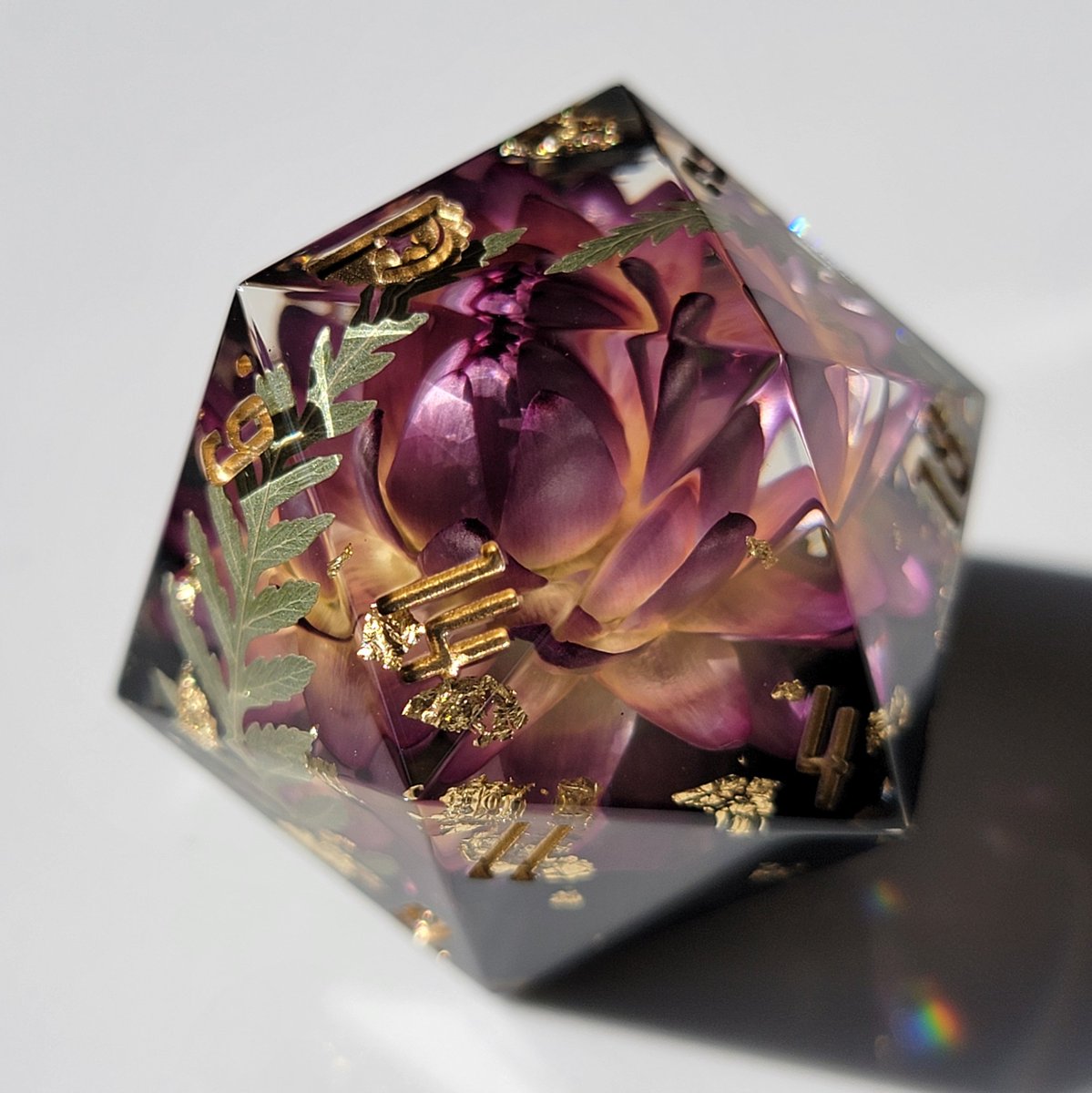 dicedumpling's tweet photo. 🌿🌸[ 𝔼𝕞𝕖𝕣𝕘𝕖𝕟𝕔𝕖 ]🌸🌿 the flower in this D20 looks like it's barely starting to bloom &amp; unfurl in the morning light 💖 also purple dice look regal af 👑✨️ https://t.co/fTUXQmKqgi