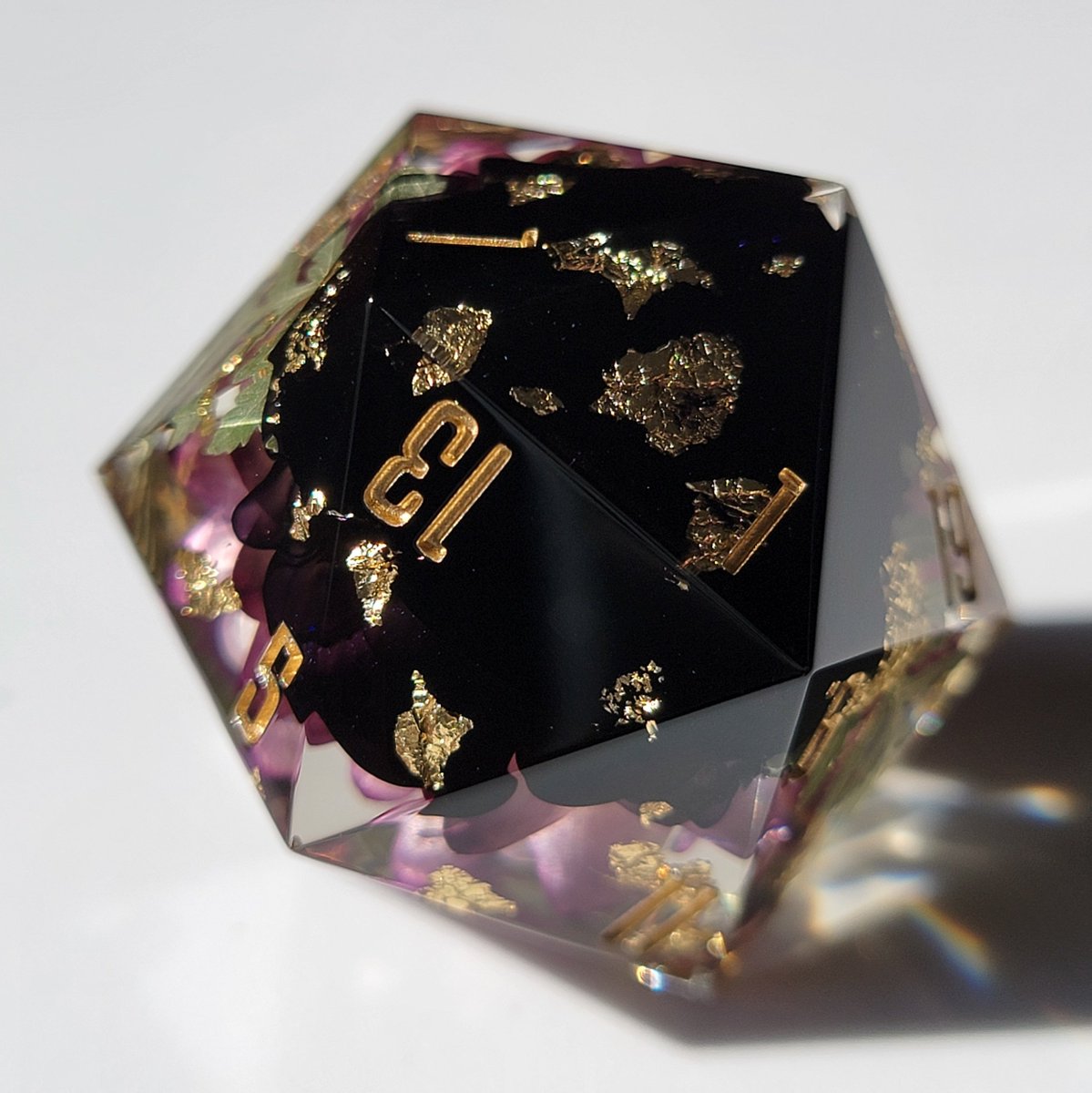 dicedumpling's tweet photo. 🌿🌸[ 𝔼𝕞𝕖𝕣𝕘𝕖𝕟𝕔𝕖 ]🌸🌿 the flower in this D20 looks like it's barely starting to bloom &amp; unfurl in the morning light 💖 also purple dice look regal af 👑✨️ https://t.co/fTUXQmKqgi