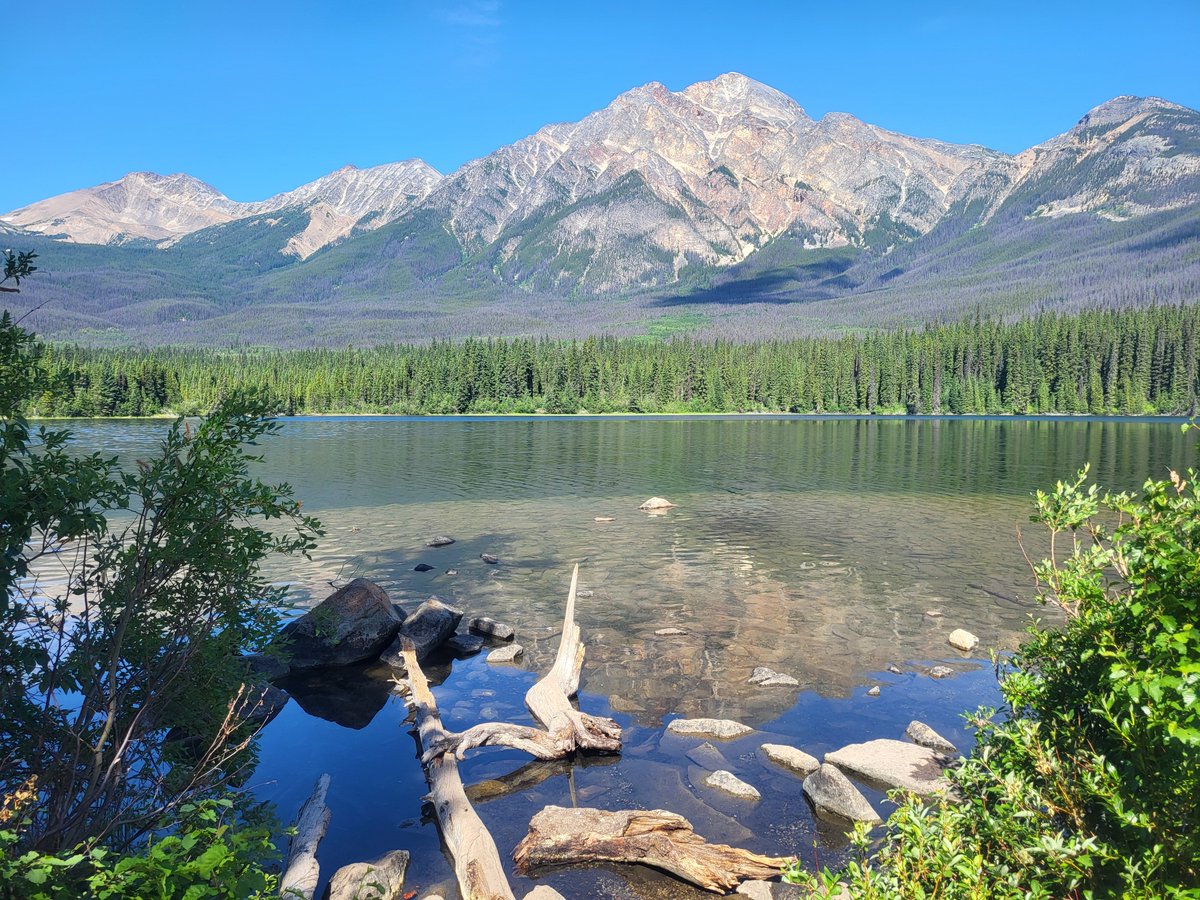SarahRyanYEG's tweet photo. I took these photos just 8 days ago. Never did I think #Jasper would be burning a week later. This is Lake Annette, near JPL. It's my favourite lake in the entire country. Warm, crystal clear water, views for days, a soft sandy bottom, loon calls and elk sightings #ABWildfire https://t.co/JxnZQ3uudm