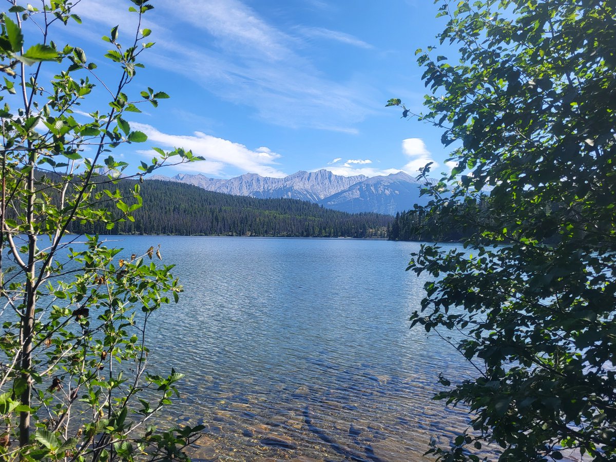SarahRyanYEG's tweet photo. I took these photos just 8 days ago. Never did I think #Jasper would be burning a week later. This is Lake Annette, near JPL. It's my favourite lake in the entire country. Warm, crystal clear water, views for days, a soft sandy bottom, loon calls and elk sightings #ABWildfire https://t.co/JxnZQ3uudm