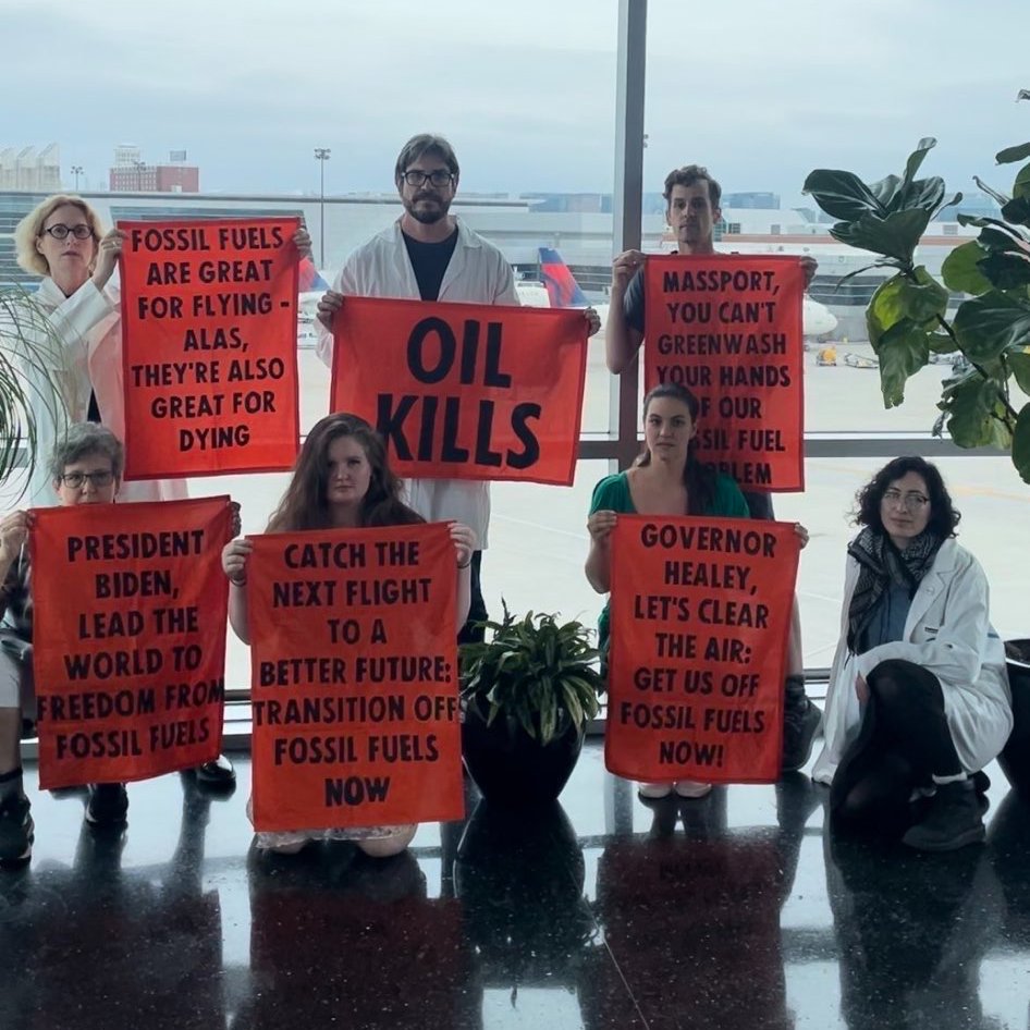 Scientists Rose (@ultracricket) and Peter (<a href="/ClimateHuman/">Peter Kalmus</a>)  took part in the <a href="/_oilkills/">Oil Kills</a> action at <a href="/BostonLogan/">Boston Logan International Airport</a> Airport demanding an end to the fossil fuel economy and for a global treaty on the Non-Proliferation of Fossil Fuels. #OilKills #KeepThemInTheGround