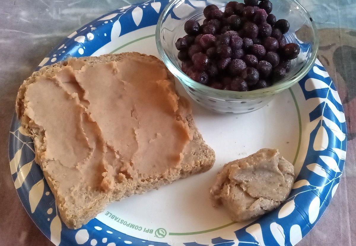 Breakfast: Ezekiel 4:9 bread topped with fat free re-fried beans and served with wild blueberries and homemade almond butter. Yum! #plantbased #HealthyFood #Breakfast