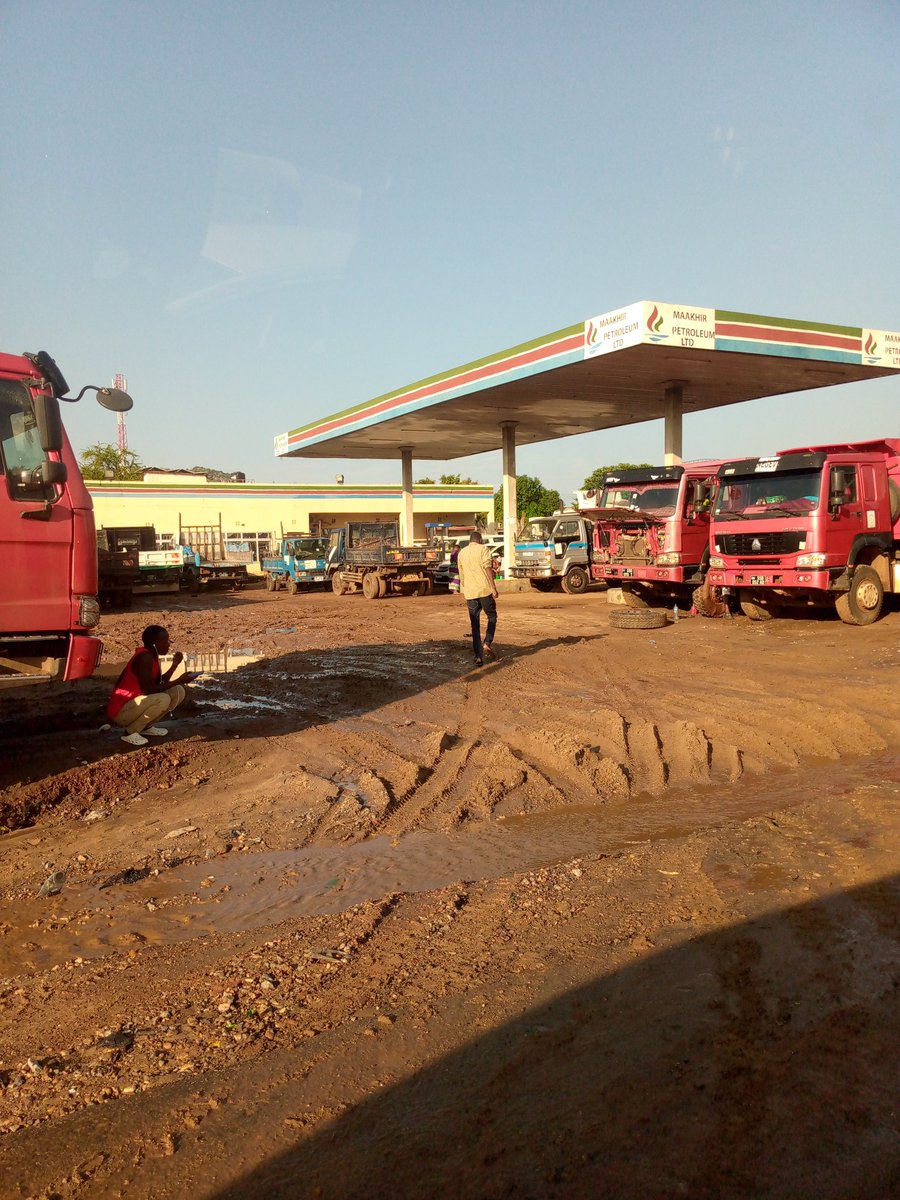 RoadsSSD's tweet photo. #SSOX. This petrol station in Gudele 1 is joking. They have been there for more than 10 years but what we get in return is damaging our tarmac with their heavy trucks. They need to be visited by the Mayor of Juba and have their license withdrawn. The place is full of mud. https://t.co/HId0WjVbdZ