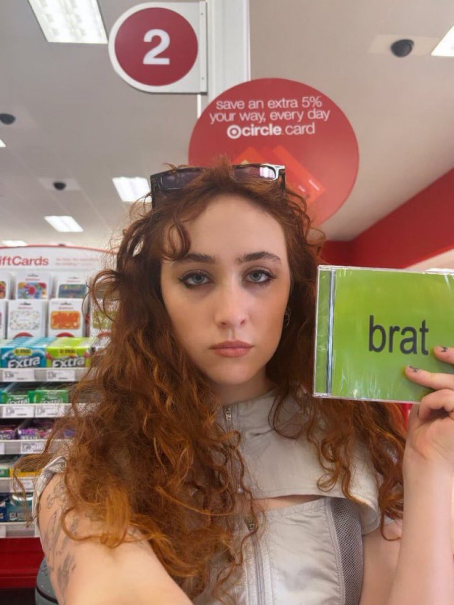 PopCrave's tweet image. Chappell Roan shares photo with a ‘BRAT’ by Charli xcx CD.