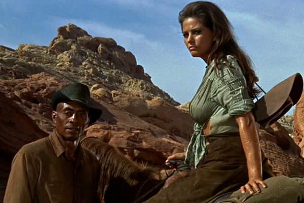 HansomRansom4's tweet photo. Happy birthday Woody Strode with Claudia Cardinale in The Professionals 1966. #WoodyStrode #actor #footballplayer #claudiacardinale #theprofessionals #1960s #sergeantrutledge https://t.co/qjkQ4DIgsE