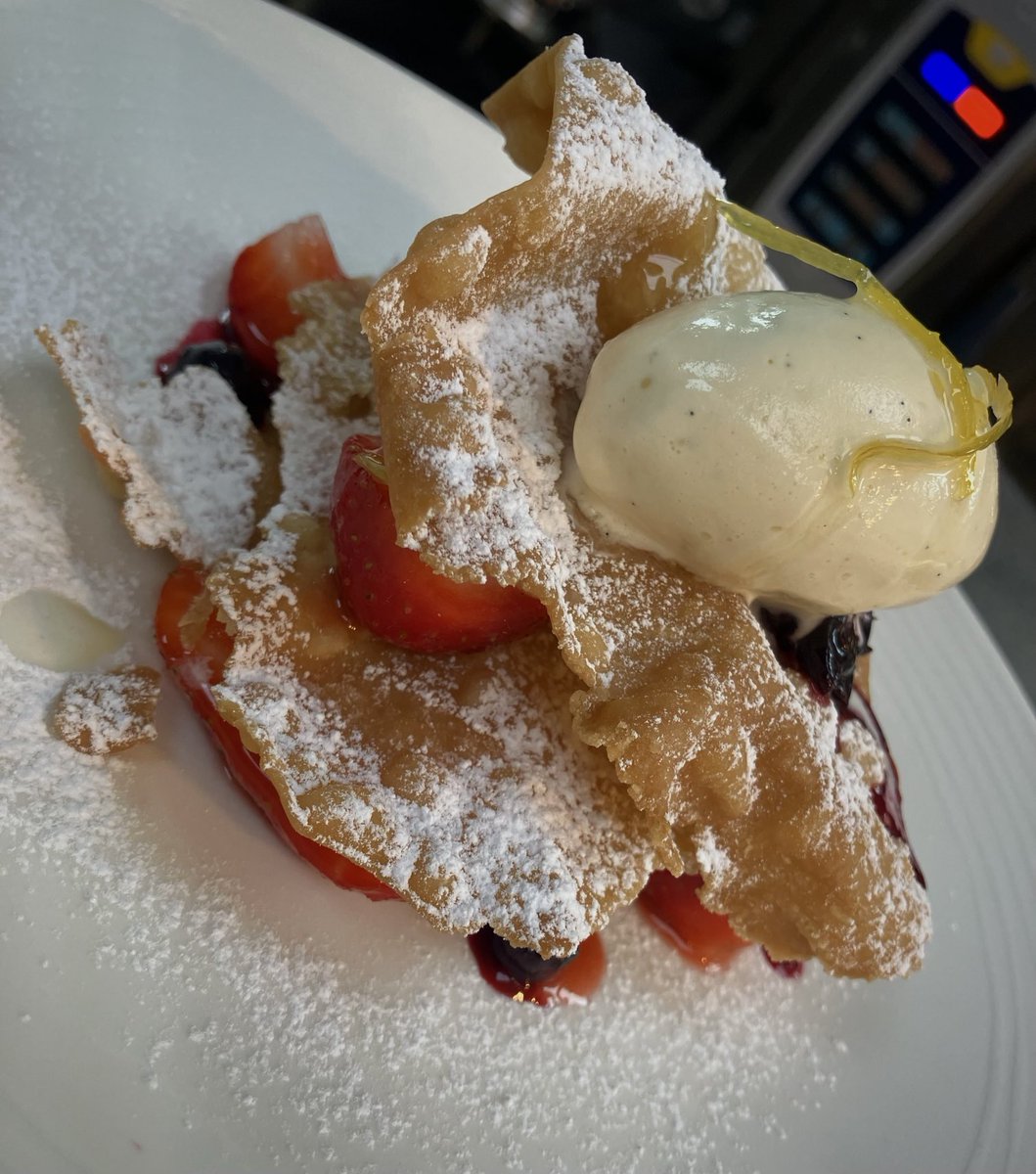 Crostoli with ricotta, strawberries, blackcurrants, honey ice cream and lemon