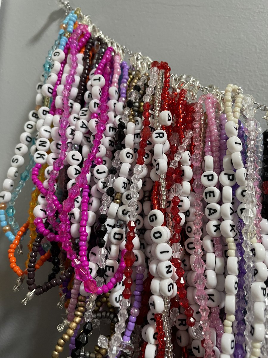 danikaaallison's tweet photo. In case you were wondering what every eras tour outfit looked like in bracelet form: 
Couldn’t have done it without the @swiftalert_13 app 😭🥰 https://t.co/3DwMNtSsTu