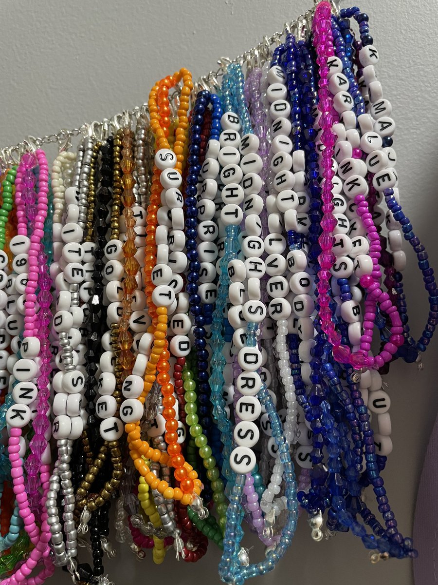 danikaaallison's tweet photo. In case you were wondering what every eras tour outfit looked like in bracelet form: 
Couldn’t have done it without the @swiftalert_13 app 😭🥰 https://t.co/3DwMNtSsTu