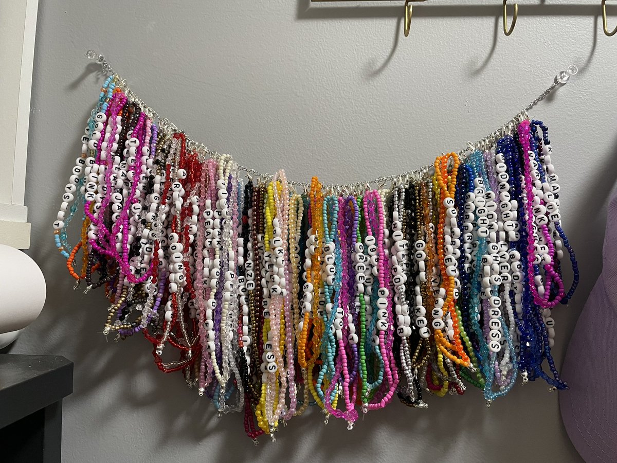 danikaaallison's tweet photo. In case you were wondering what every eras tour outfit looked like in bracelet form: 
Couldn’t have done it without the @swiftalert_13 app 😭🥰 https://t.co/3DwMNtSsTu