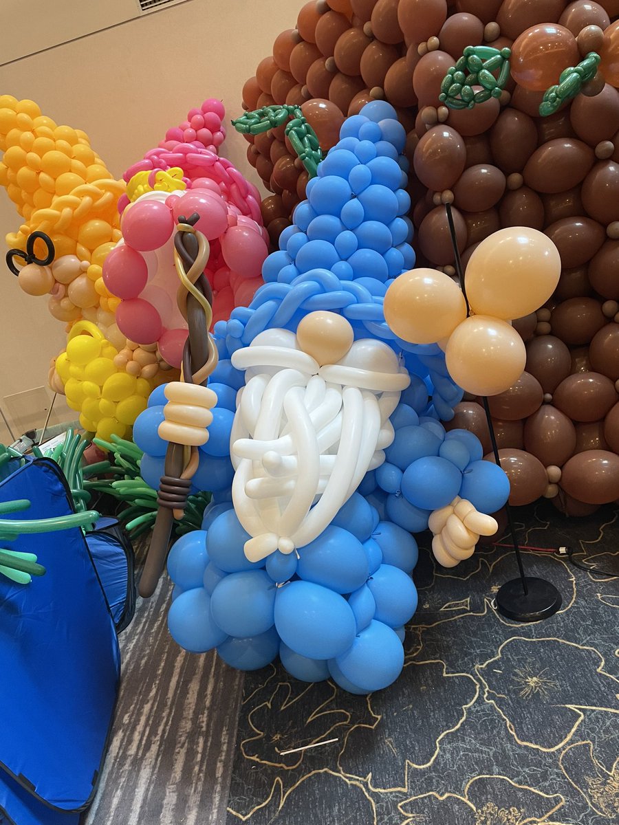 flyingmonkeycg's tweet photo. How much fun is @Gen_Con - it feels like a Gnome away from Home! Always fun to see the Balloon Animal scene as it grows! https://t.co/WttFN8Xct1