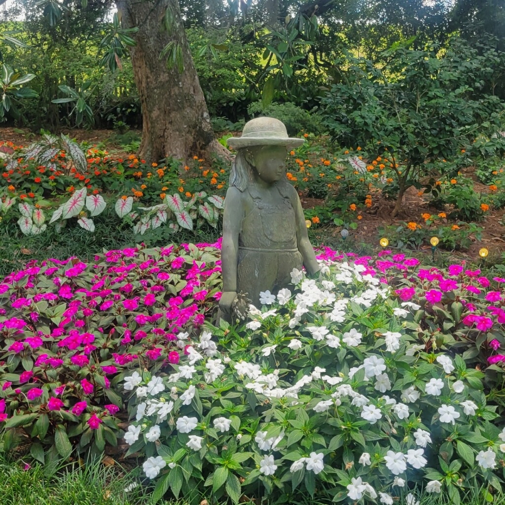 Blending delicate flowers with bronze statues creates Magic in our Gardens!   
Photo by Cheryl Sullivan