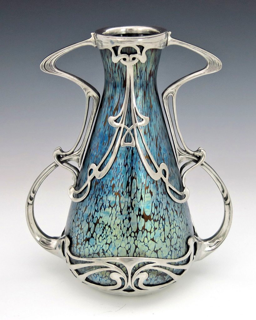 NouveauDeco's tweet photo. Art Nouveau glass vase with silver overlay from c. 1900 by Loetz, Bohemia (present day Czech Republic). https://t.co/N49RLA89TH