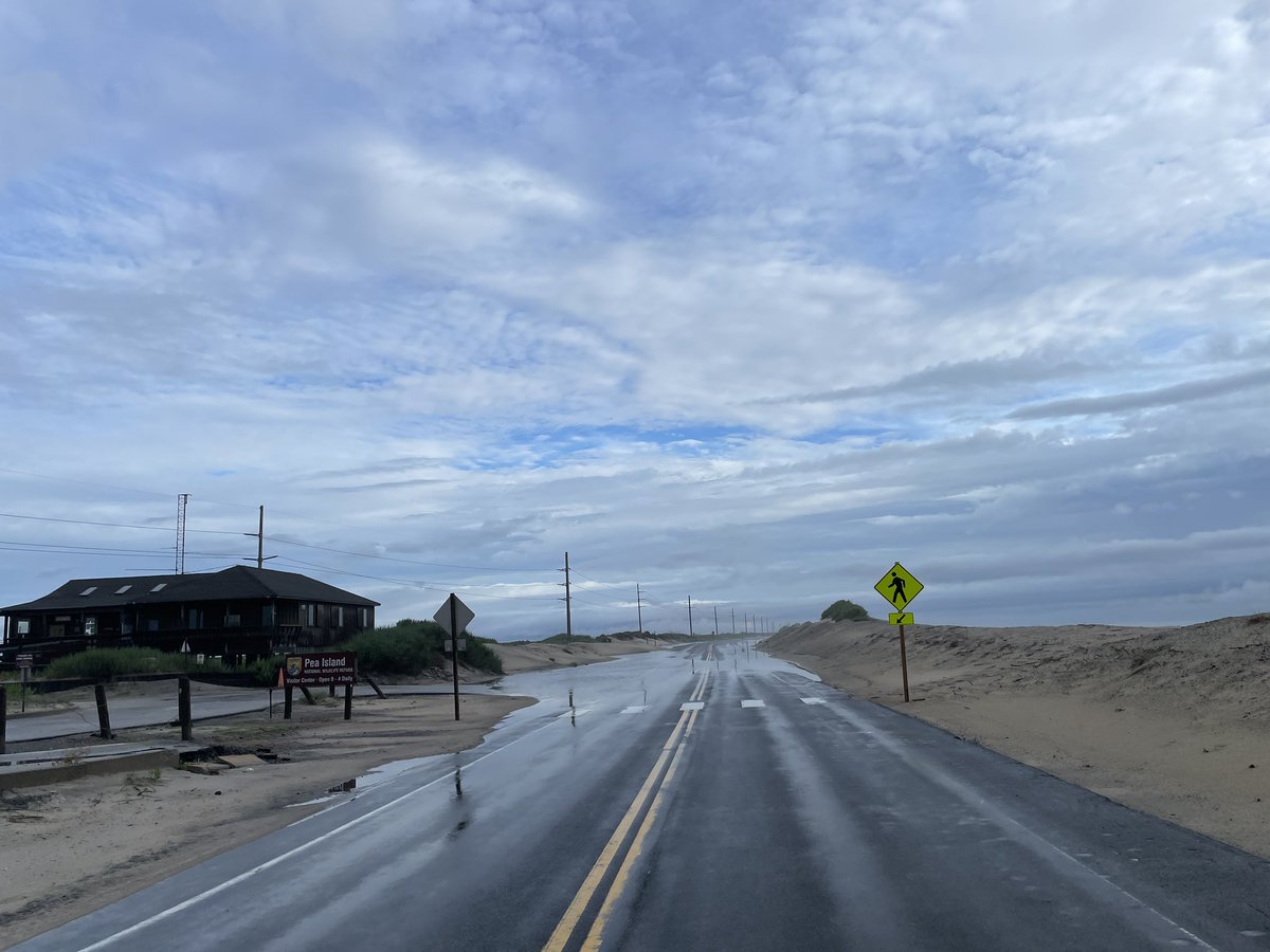RippleEnviro's tweet photo. Heavy rain and heat
Saturated sandy soil
Puddles on the street

Field observations along @NCDOT_NC12 and reported precipitation amounts by 
@NWSMoreheadCity indicate a soggy landscape awaits tropical activity. 
#obx #dunex #haiku https://t.co/IlitlQUj5H