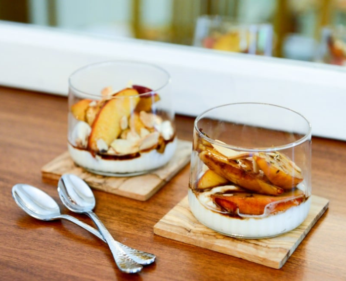 Simmering an everyday #balsamic vinegar w #honey turns it into a delectable syrup that pairs well with fruit &amp; cheese. Here, it’s tossed w #peaches &amp; thyme &amp; served over an almond-infused #ricottacream.  Easy &amp; inexpensive, yet it tastes like pure luxury. tinyurl.com/bdfxu5xb