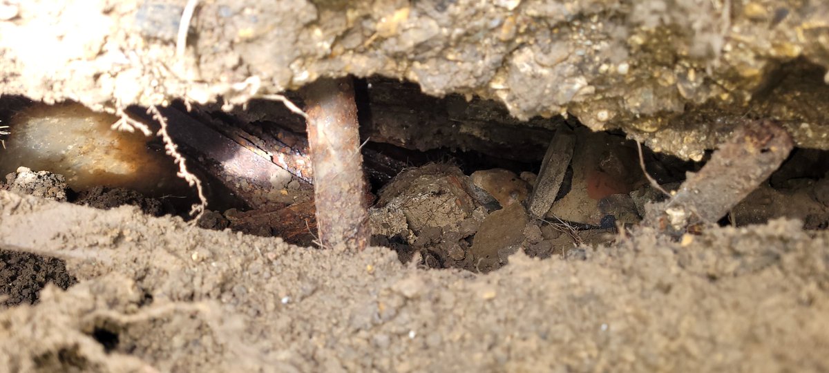 DrAdamReed's tweet photo. Investigating a dip in the grass and discovered what appears to be an underground air raid shelter. Only problem - this was a field during the war?! Community shelter, possibly? Excavation will continue tomorrow.#ww2 #airraidshelter #ukhistory #bunker #GardeningTwitter https://t.co/CpXGEyyTR9