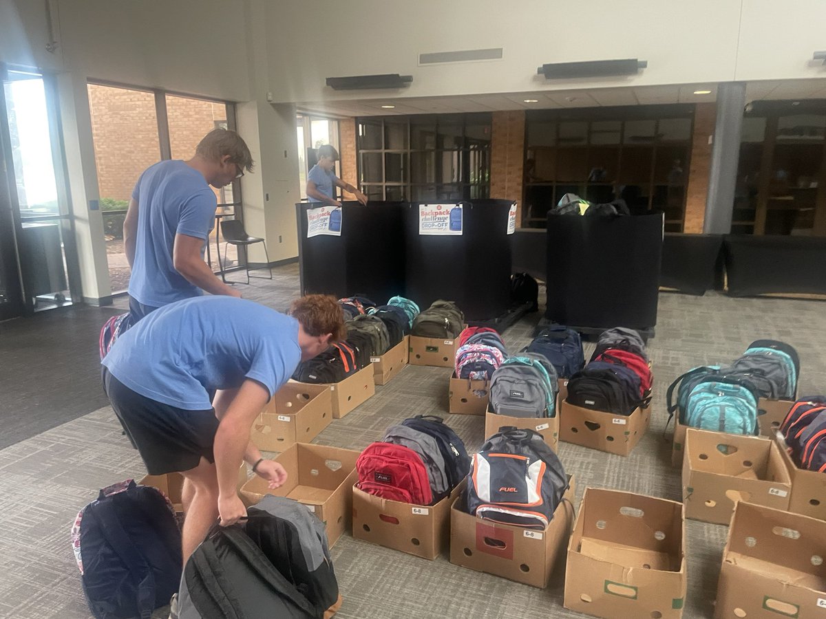OGorman football team serving at the Banquet. Players filled, sorted, and loaded backpacks for project SOS providing school supplies to students in our community