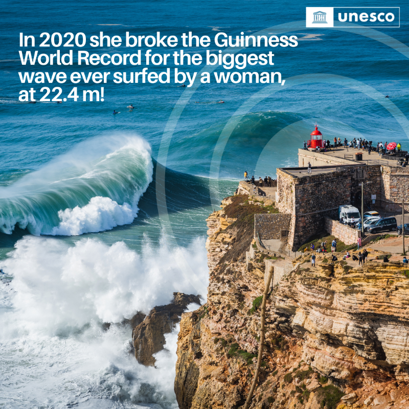 UNESCO's tweet photo. @UNESCO's Champion for the Ocean and Youth, @MayaGabeira, has not only conquered enormous waves but also set numerous world records, inspiring a new generation of surfers.

Maya continues to #ChangeTheGame! 🏄‍♀️