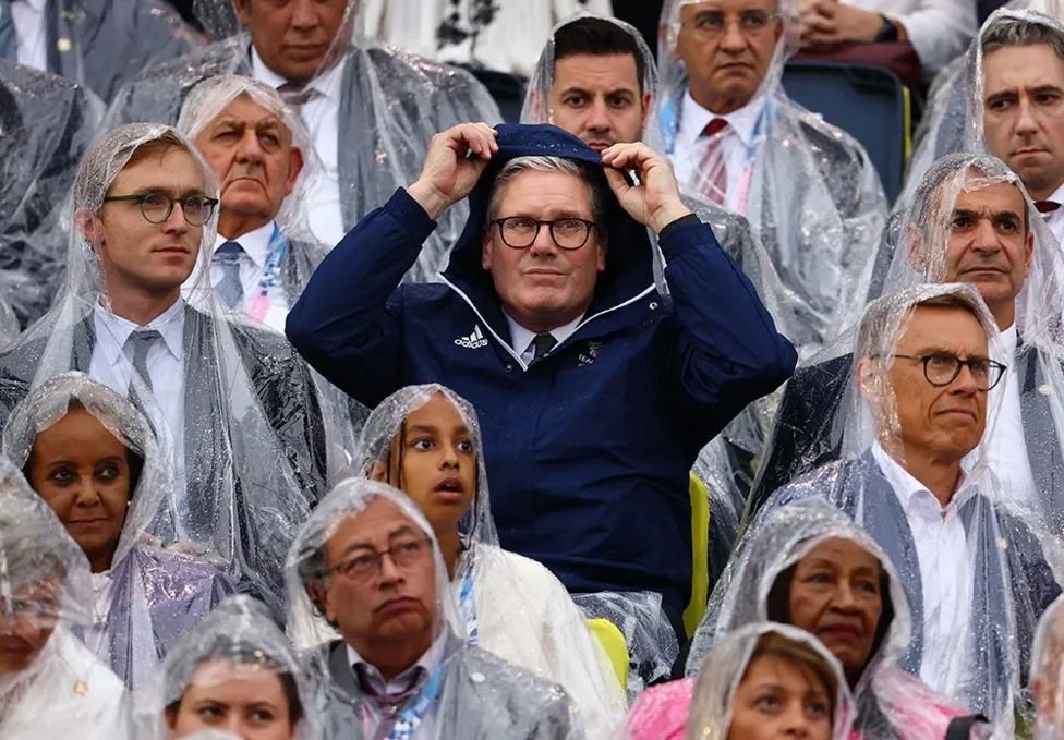 We've gone from a Prime Minister who didn't own an umbrella, to the only one who thought to bring a jacket to the #OpeningCeremony