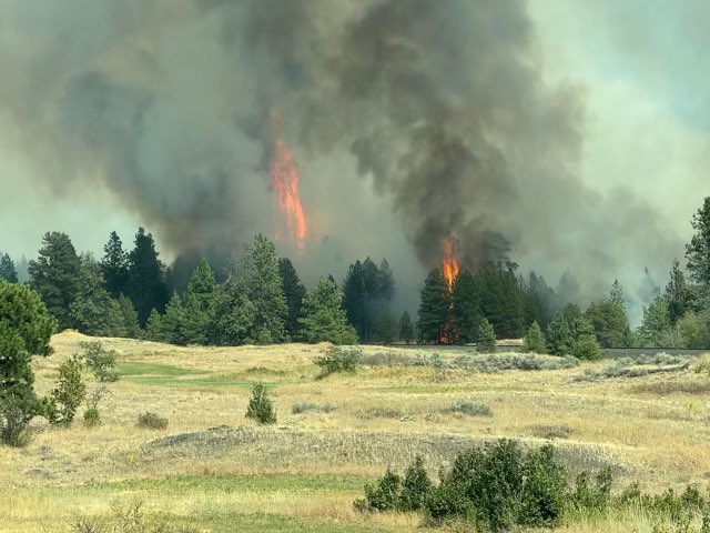 WSDOT_East's tweet photo. Pictures of a the wildfire burning in southwest Spokane County sent from our Incident Response Team. No closures to I-90 or SR 904 at this time. https://t.co/KGPIbuQJ0z