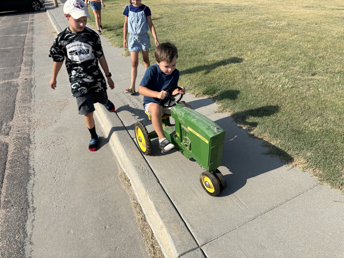 tbeougher's tweet image. John Deere pedal tractor I got as my 4th birthday gift in 1963. My 4-year old grandson James Timothy riding it today. #nothingrunslikeadeere