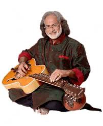 Vishwa Mohan Bhatt is a Hindustani classical music instrumentalist who plays the Mohan Veena (slide guitar). He is also known as V. M. Bhatt. Bhatt is best known for his Grammy award-winning album “A Meeting by the River” with Ry Cooder released on Water Lily Acoustics label.