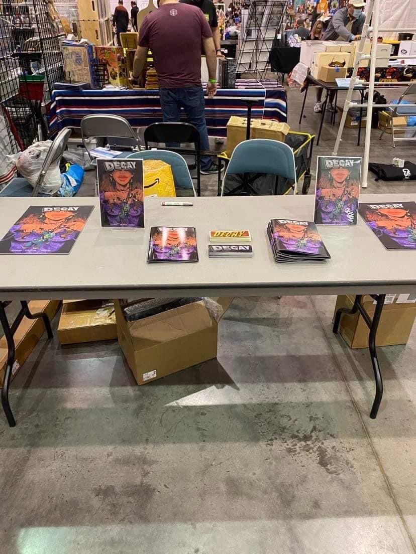 StokesTheWriter's tweet photo. Always amazed comparing my first con table vs a year or two later https://t.co/sh7I3lfVNz