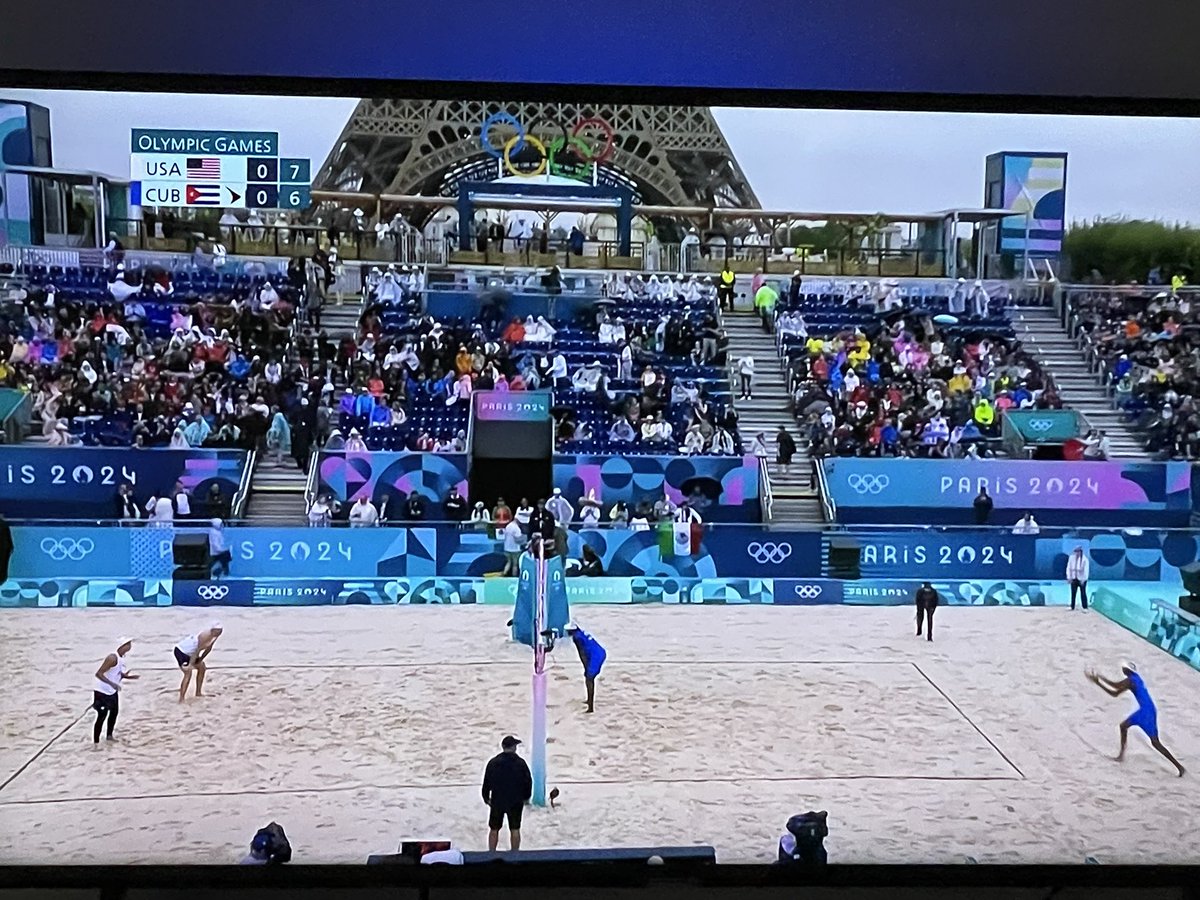 Watching beach volleyball near the Eiffel Tower, shoutout to <a href="/chelseambrosia/">Chelsea Powell</a> producing the games in Paris, the boys ask if there is beach that close to the tower 😂. Fun fact, former #NBA player, Chase Buddinger is in the #Olympics for beach volleyball. #OlympicGames
