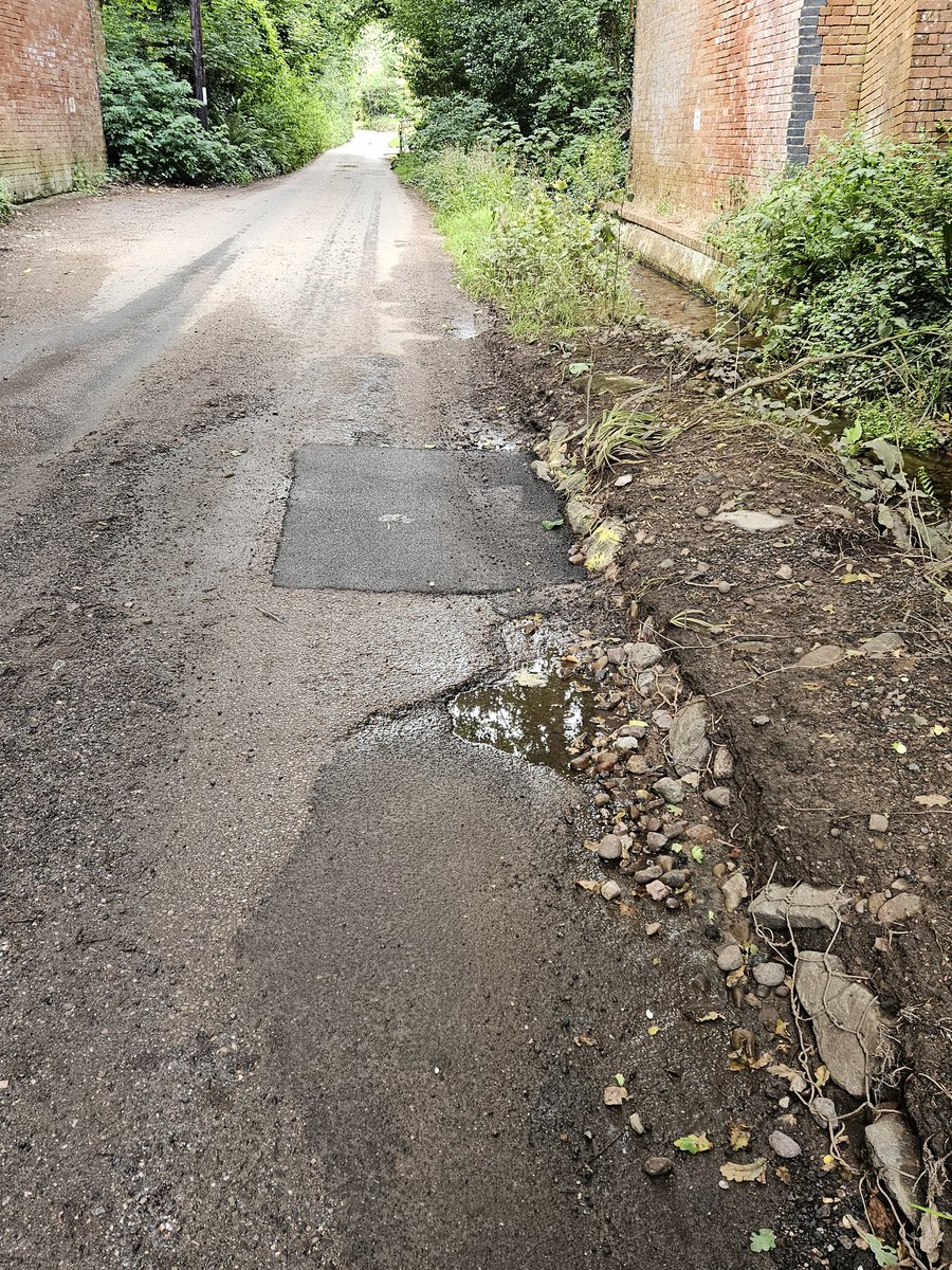 ExeSmokehouse's tweet photo. @DevonCC I'm no civil engineer but these 'repairs' look pretty rubbish to me. Besides the awful job done , you need to fix the constantly running water over the road before the surface surely? The water constantly runs and is trashing the road. Dalditch Lane, Budleigh Salterton https://t.co/cJXwog3xes