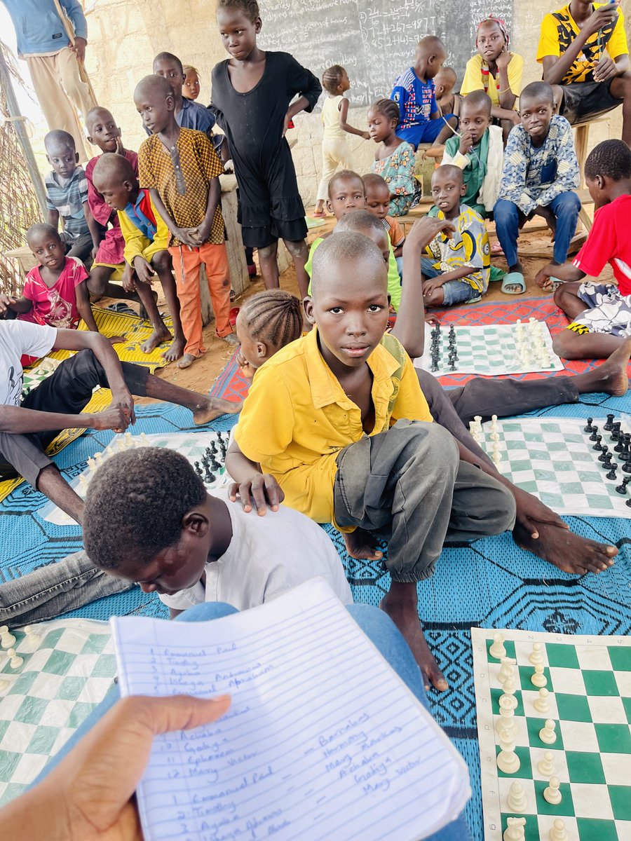 ibrahimvivian51's tweet photo. Our kids from the IDP camp went to the farm few weeks ago and were talking about chess, Much to their surprise, a person working at a nearby farm heard them and revealed to them that he was once a chess champion and had earned a prestigious medal. The idea of winning a medal sparked excitement among the children, leading to the decision to organize a mini chess tournament where the top position would be awarded a medal today.   
It was really a chess fun filled day as their eyes lit up when they saw me bring out the medal.
Thank you EMNAMU foundation for the cash prizes and medal.